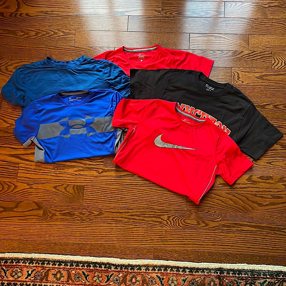 5 Boy T-Shirts including the brands Under Armour, Nike, RBX, and Champions
